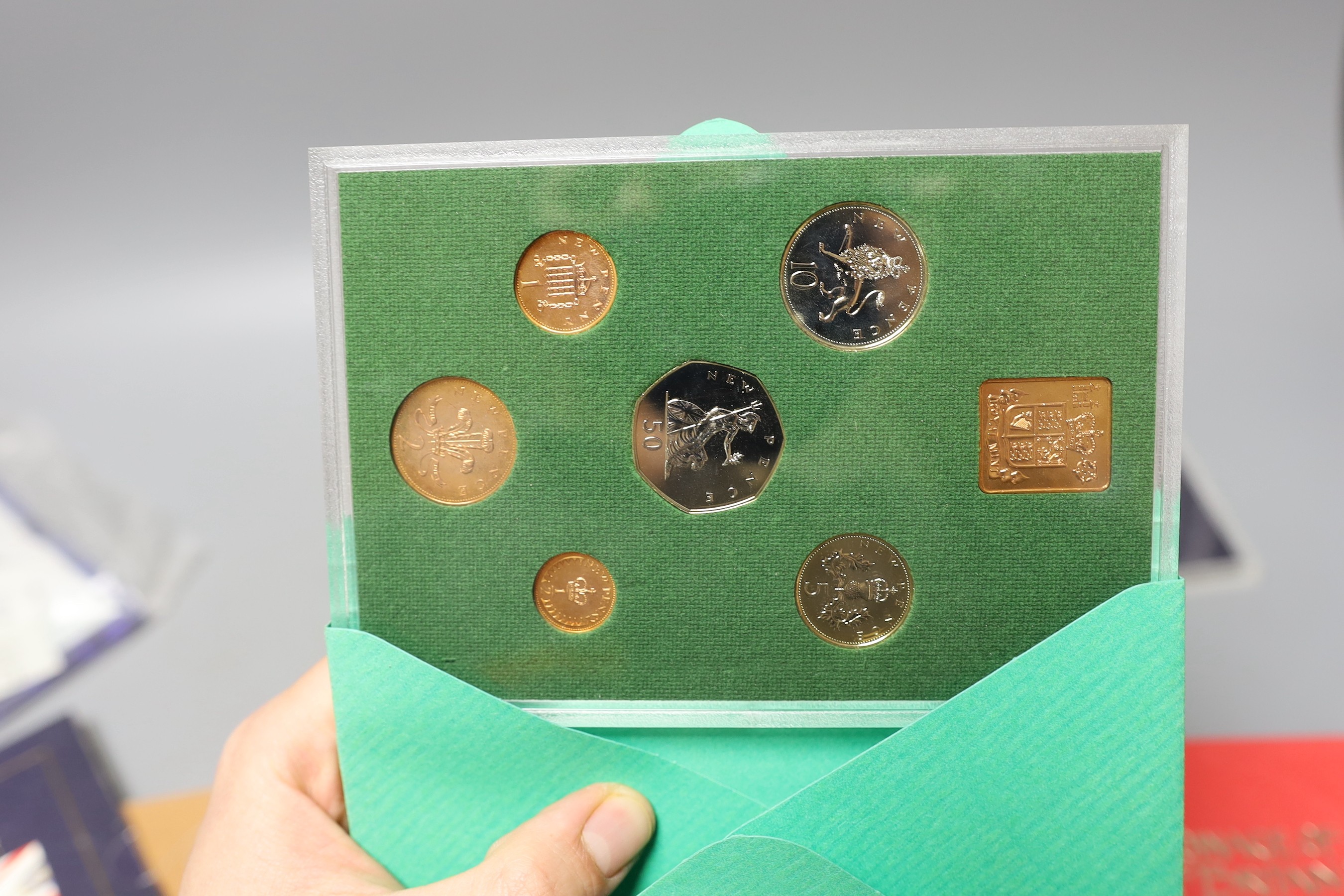 A group of UK Royal Mint BU year sets.